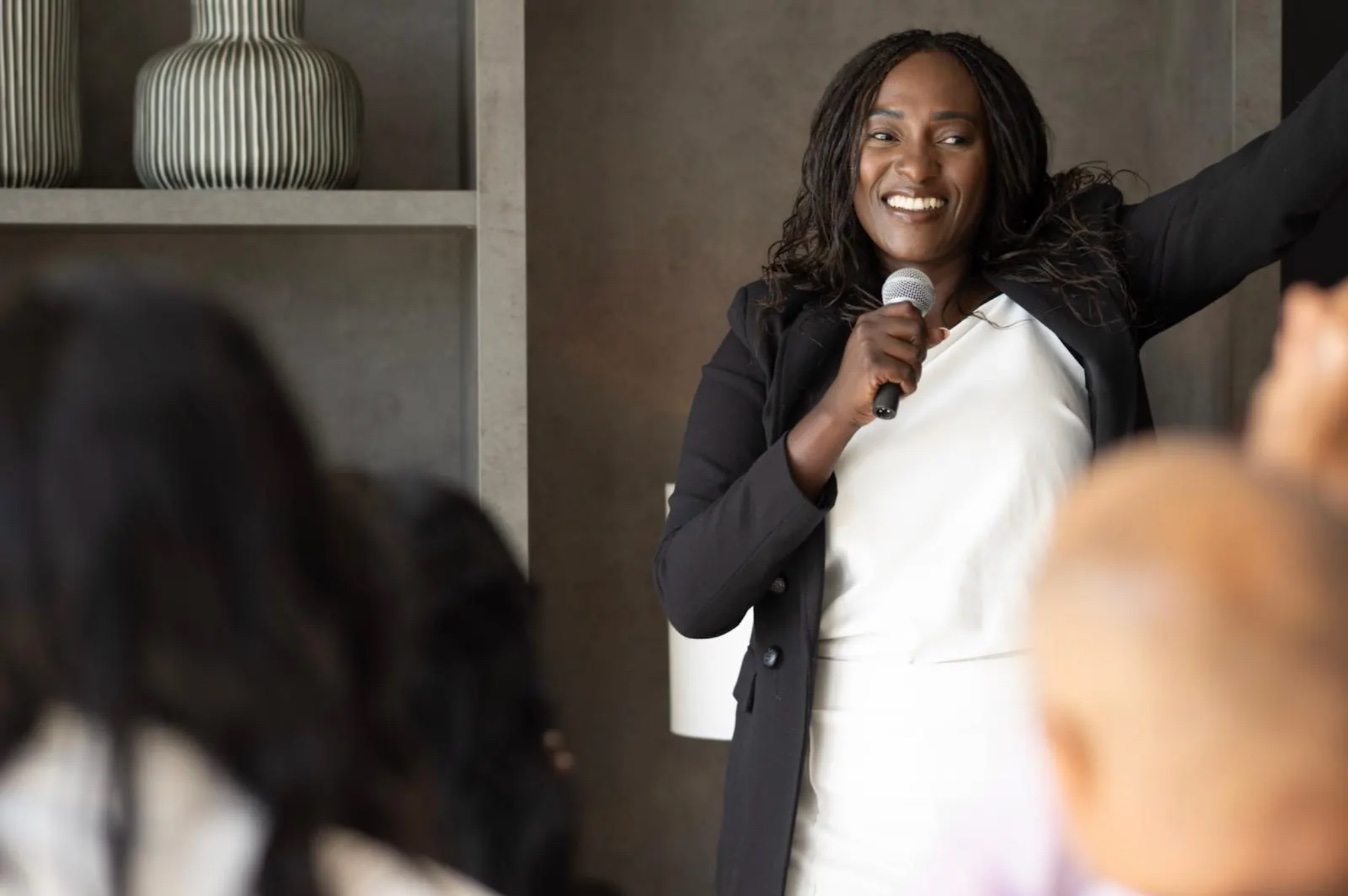Gladness Katega speaking to an audience